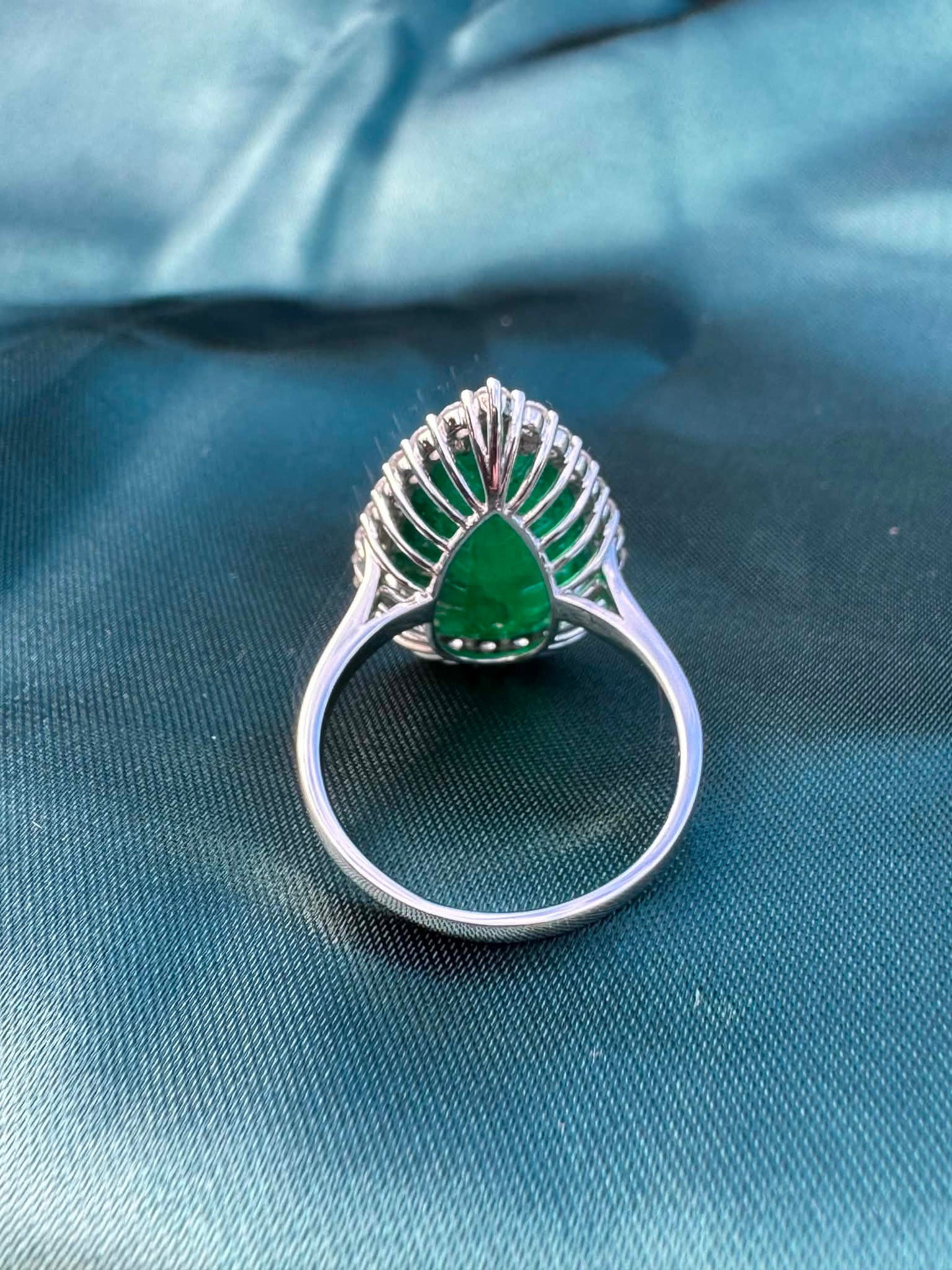 8.28ct pear emerald and diamond halo ring in platinum, reverse