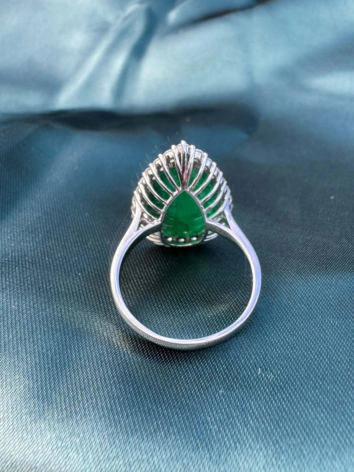 8.28ct pear emerald and diamond halo ring in platinum, reverse