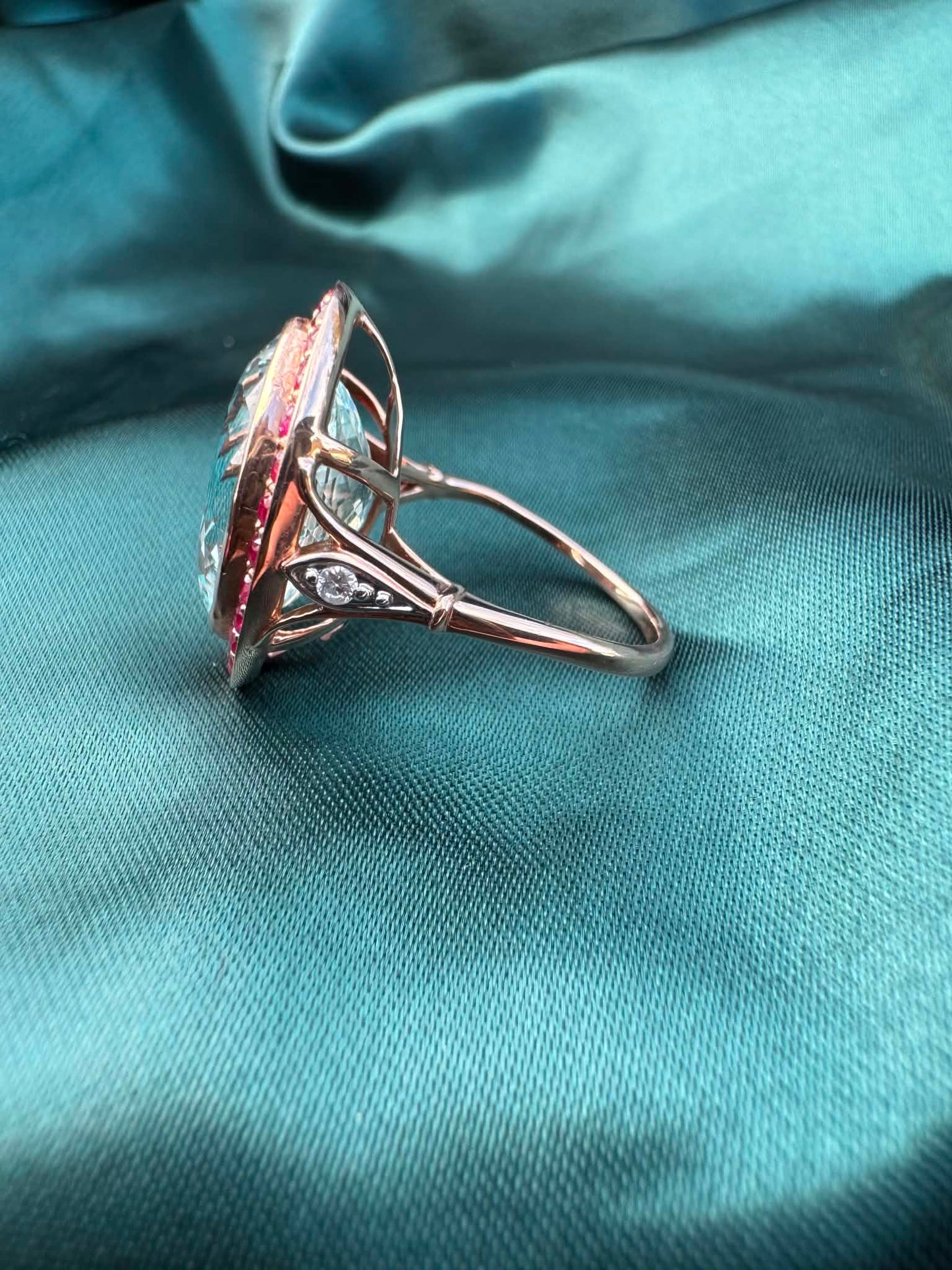 Aquamarine and gemstone halo ring in 14ct rose gold, side profile showing band and setting