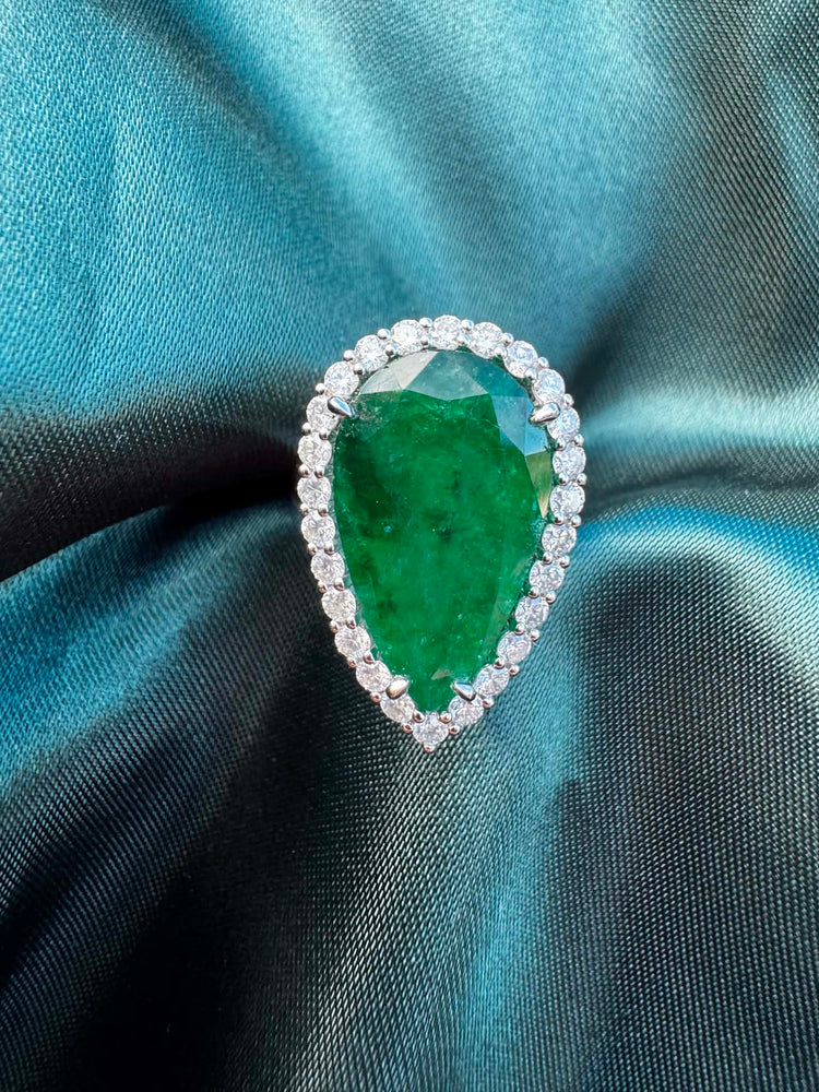8.28ct pear emerald and diamond halo ring in platinum