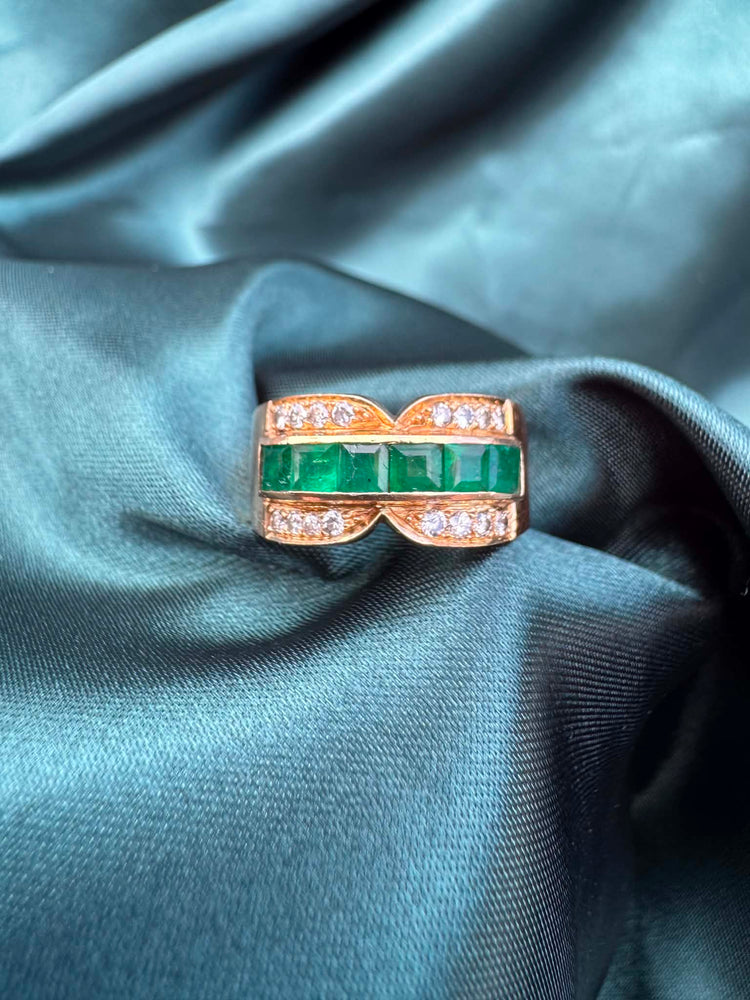 Emerald and diamond dress ring in 18ct yellow gold, front view showing square-cut emeralds and diamonds