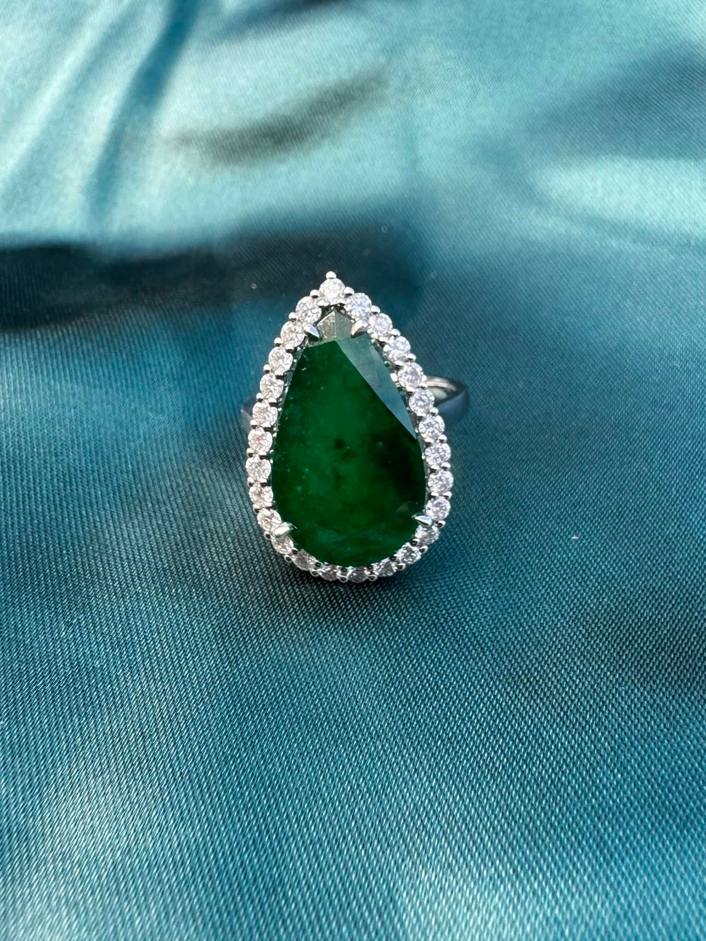 8.28ct pear emerald and diamond halo ring in platinum, top view