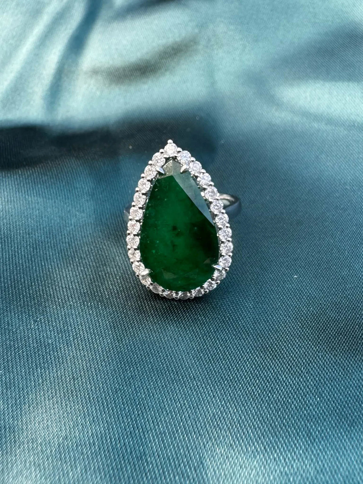 8.28ct pear emerald and diamond halo ring in platinum, top view