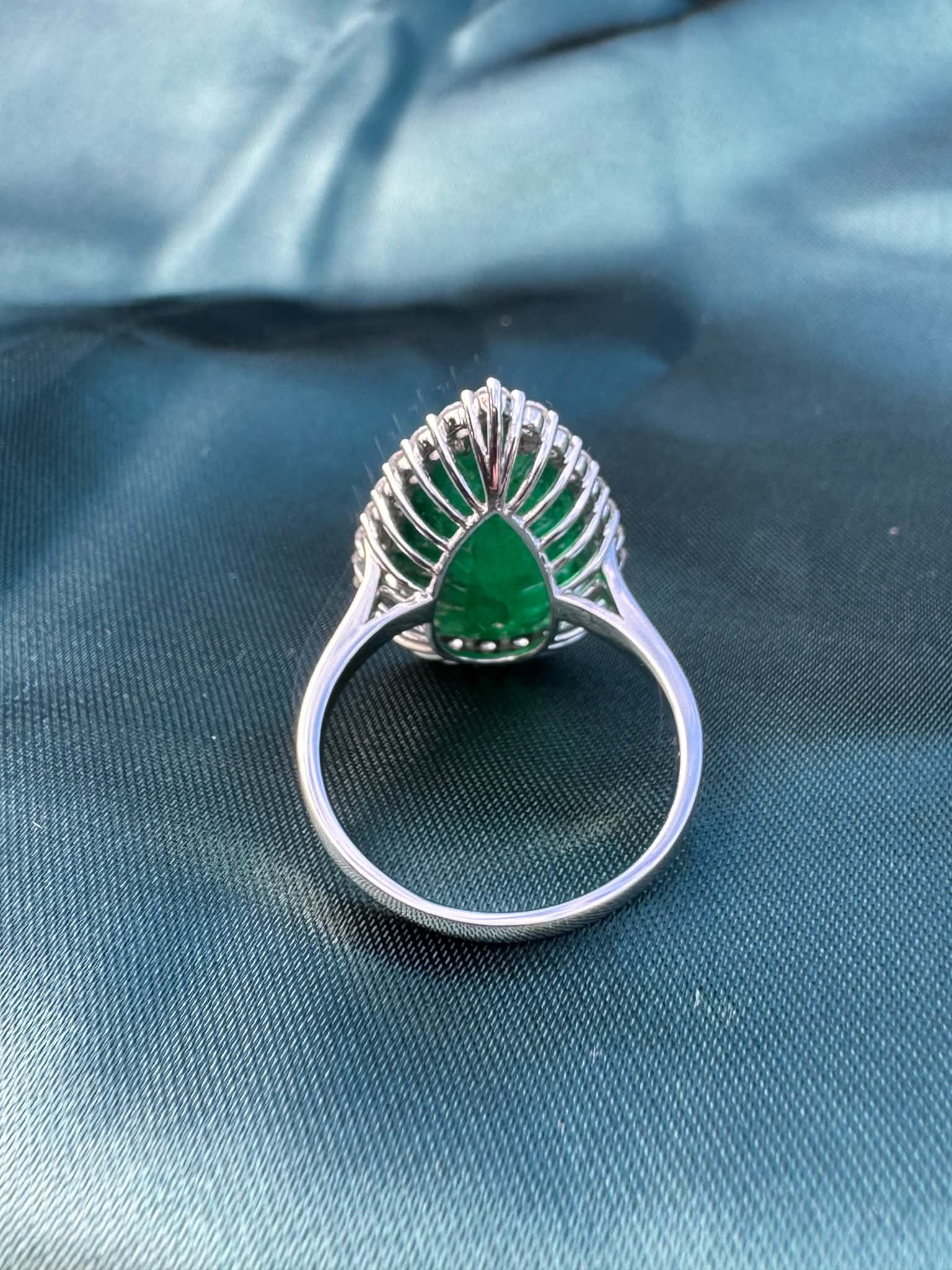 8.28ct pear emerald and diamond halo ring in platinum, reverse