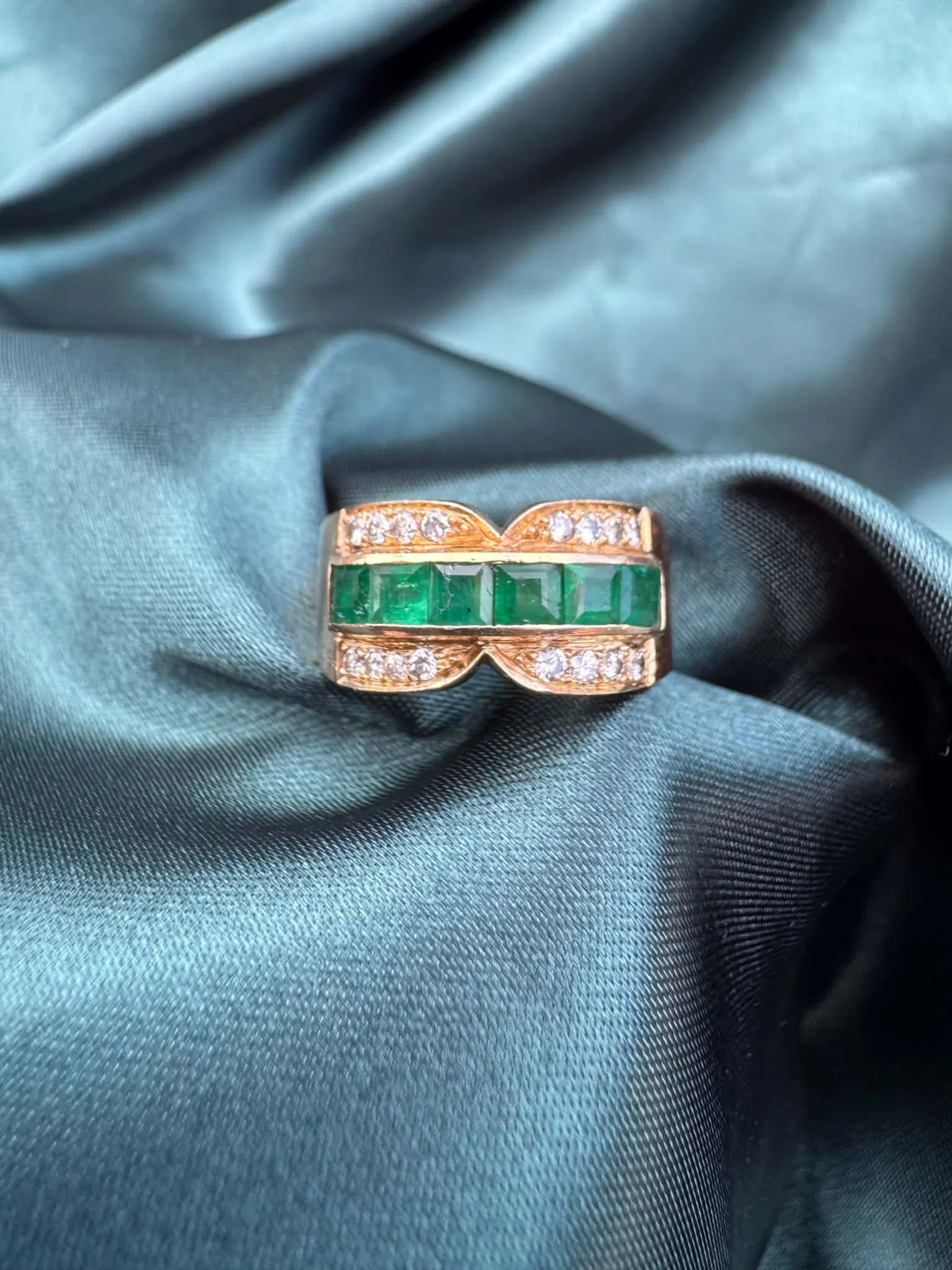 Emerald and diamond dress ring in 18ct yellow gold, front view showing square-cut emeralds and diamonds