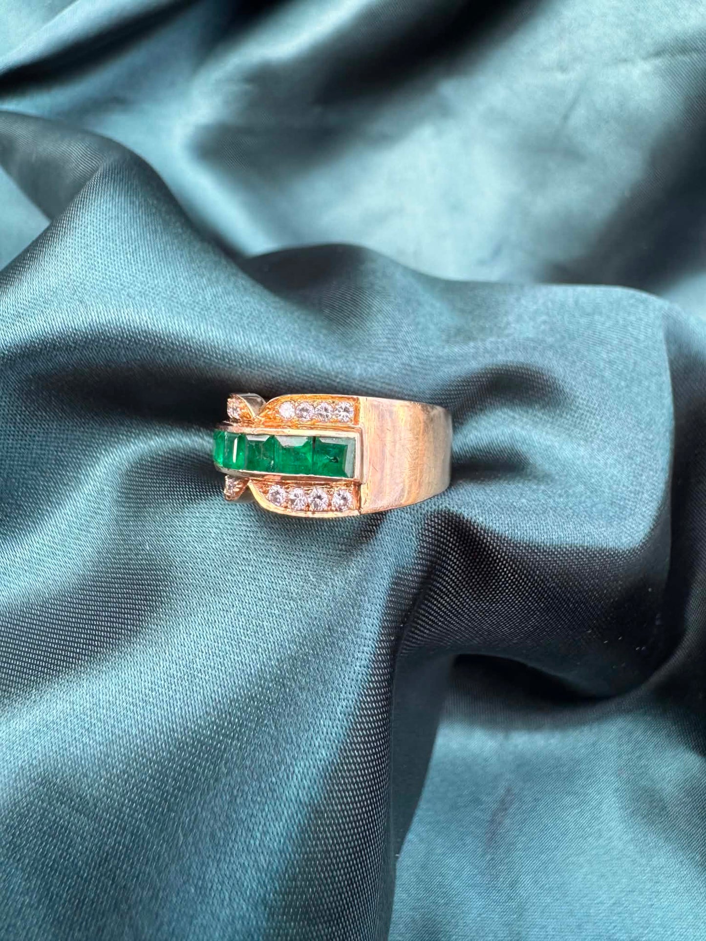 Emerald and diamond dress ring in 18ct yellow gold, angled top view showing emeralds and diamonds