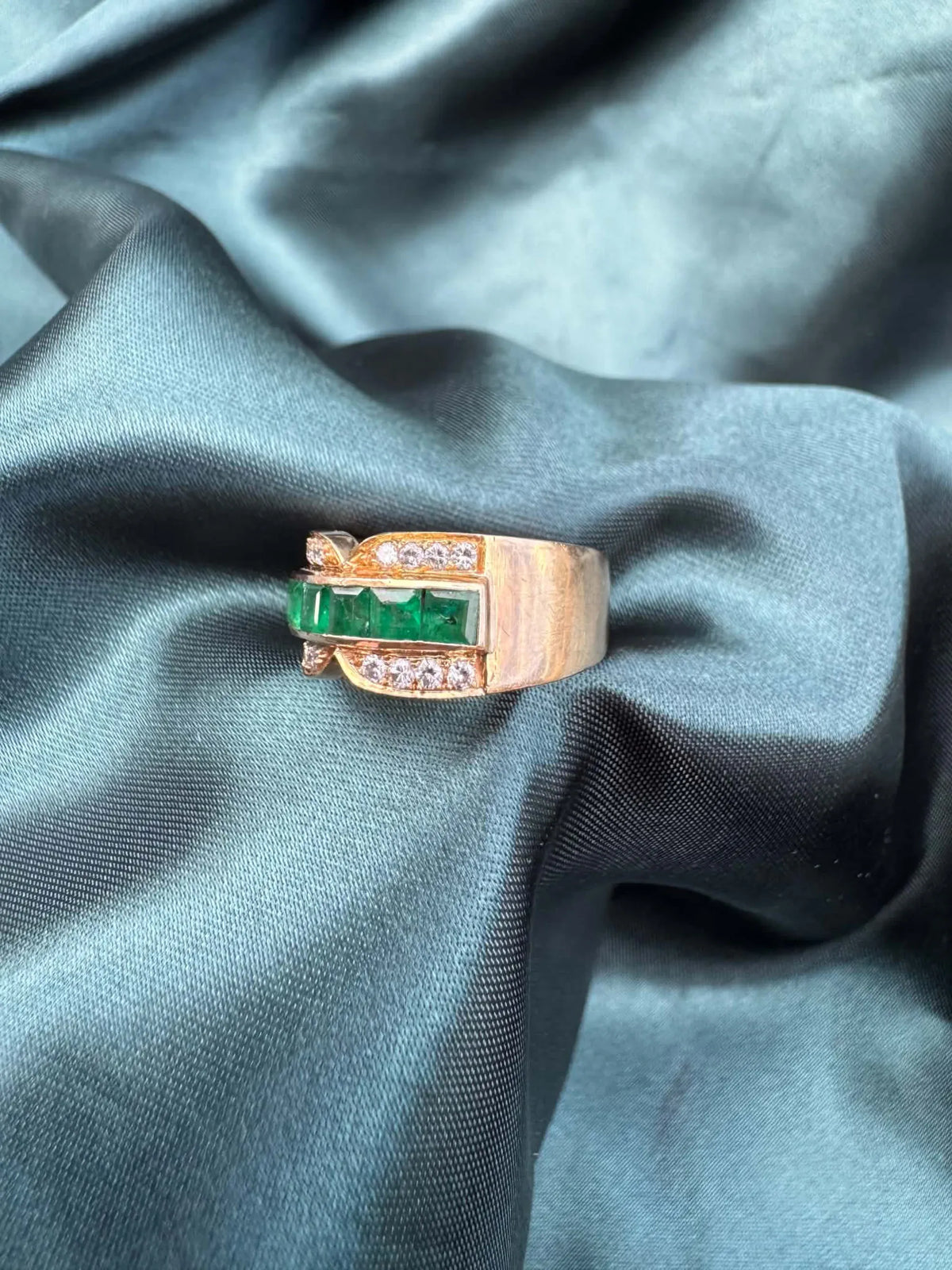Emerald and diamond dress ring in 18ct yellow gold, angled top view showing emeralds and diamonds