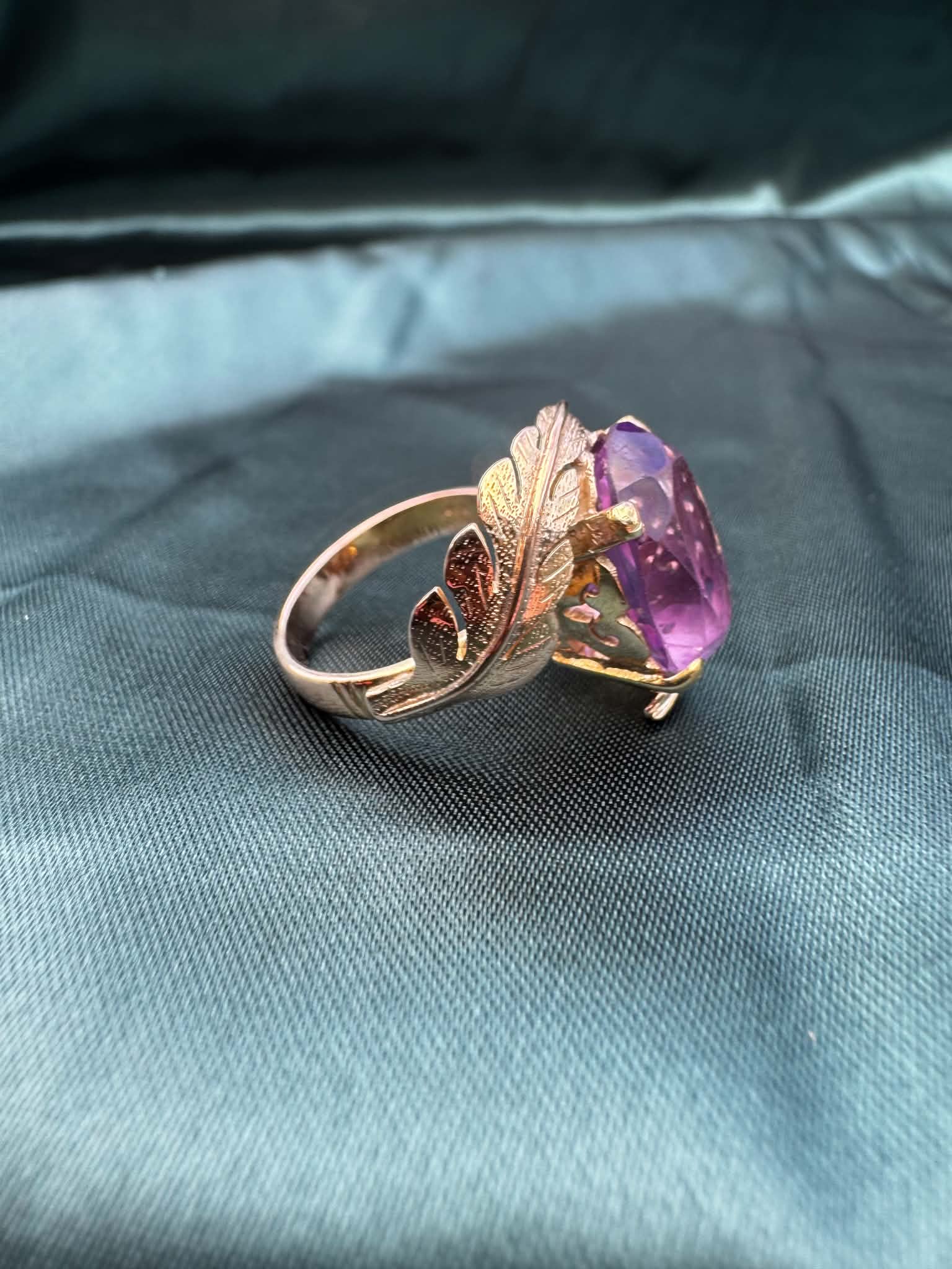 Amethyst foliate crossover cocktail ring in 14ct yellow gold, angled view showing foliate detail