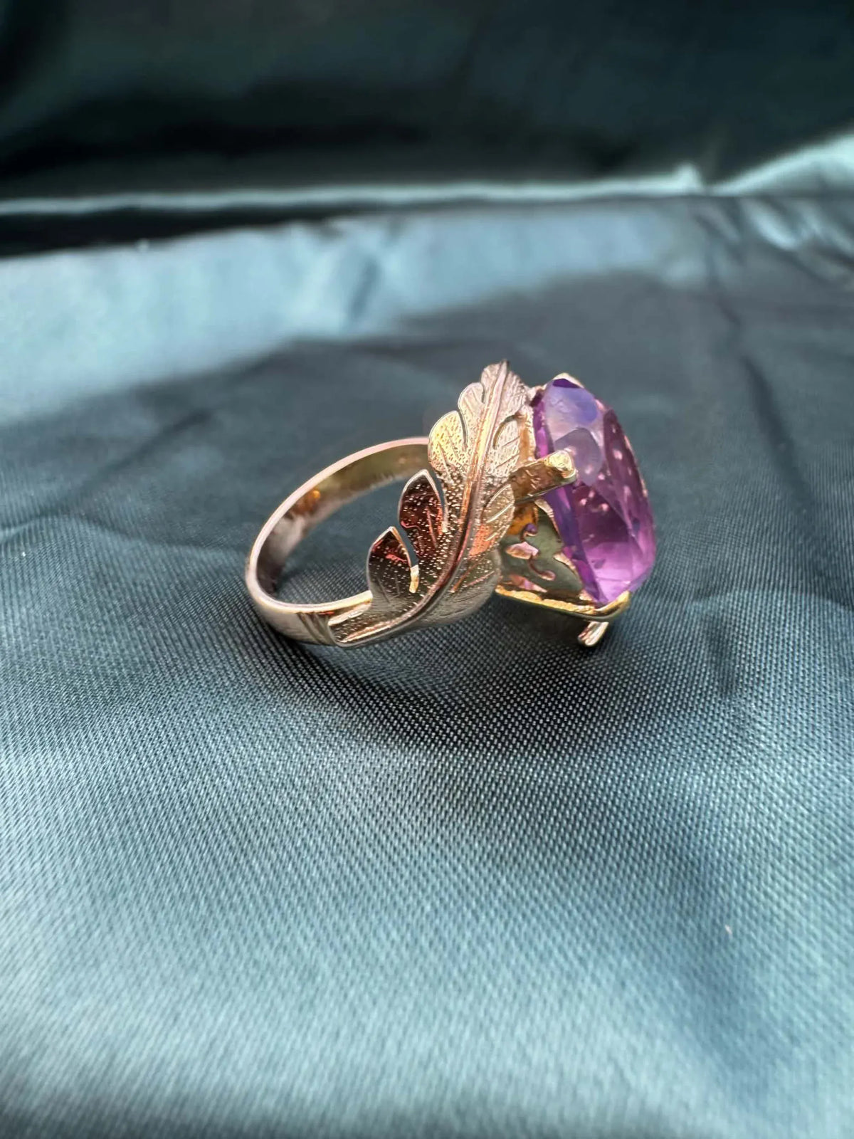 Amethyst foliate crossover cocktail ring in 14ct yellow gold, angled view showing foliate detail