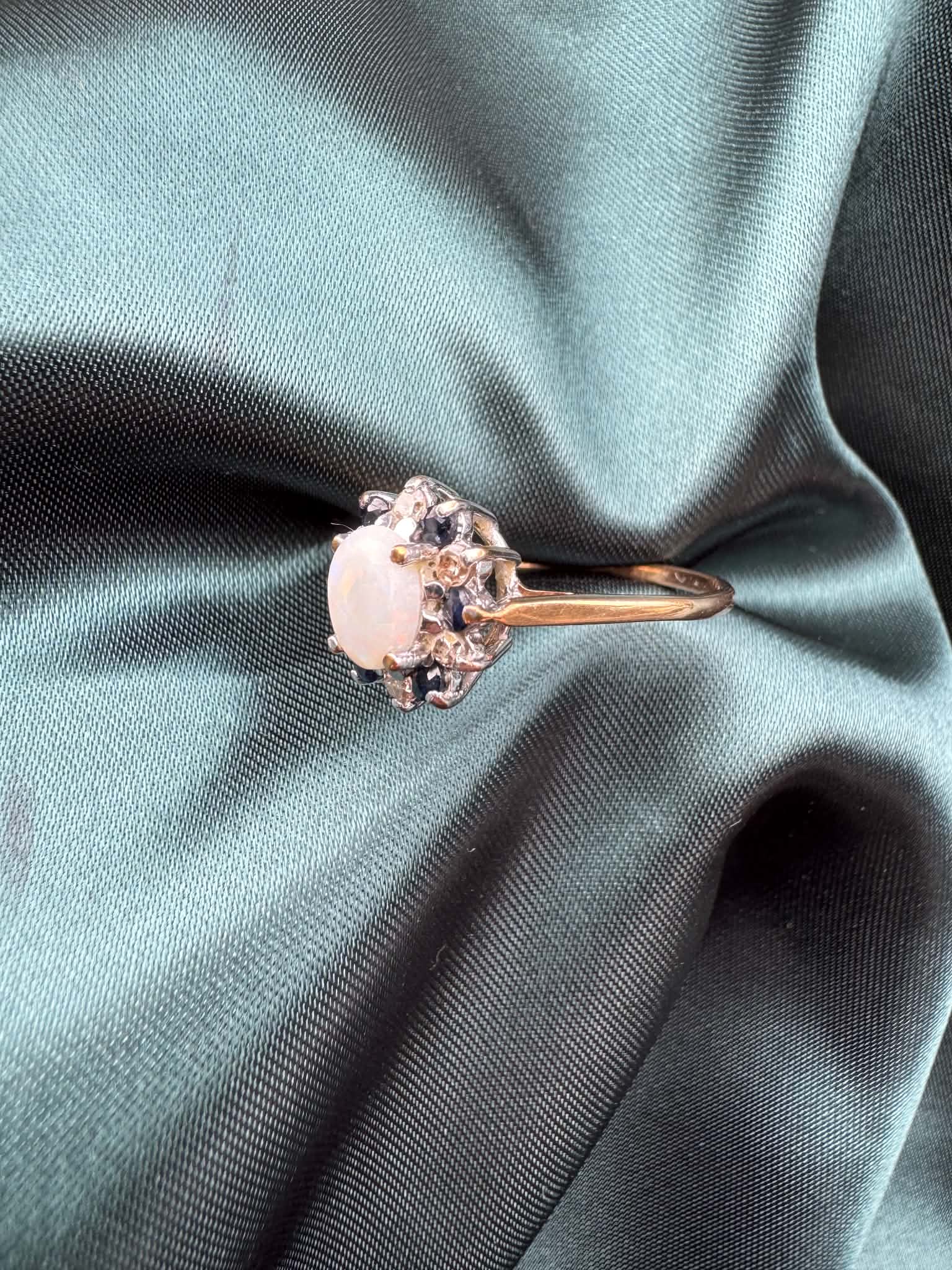 Opal, diamond and gem cluster ring in 9ct yellow gold, side profile view