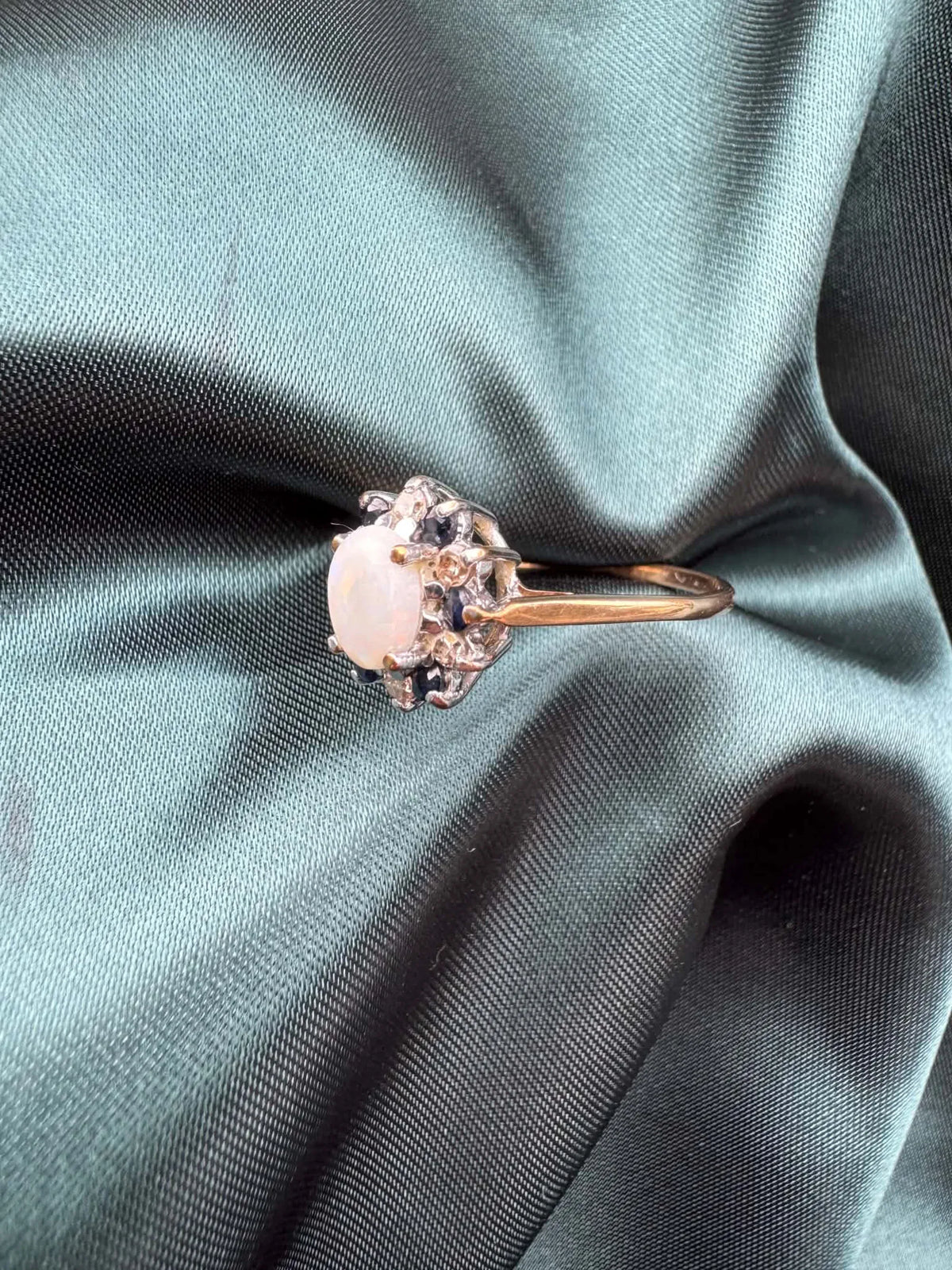 Opal, diamond and gem cluster ring in 9ct yellow gold, side profile view