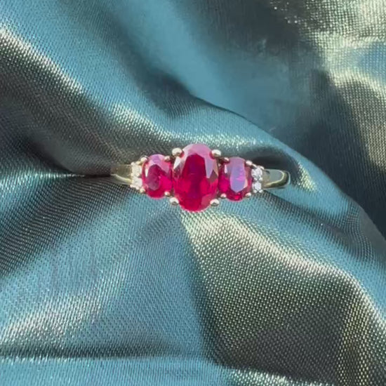 Ruby and diamond trilogy ring in 9ct yellow gold